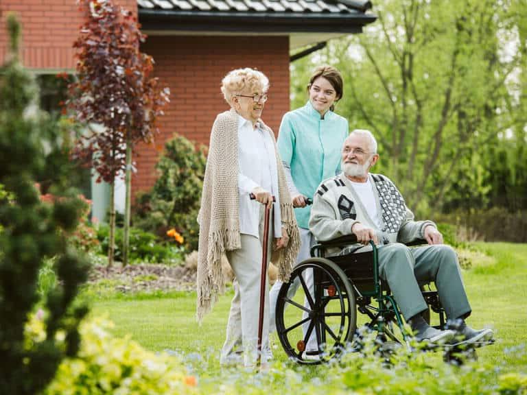 Senior man in wheelchair outside of senior living facilities